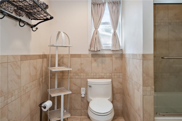 11 Walnut St, Phelps, NY 14533 - bathroom with tile walls, a shower stall, and wainscoting