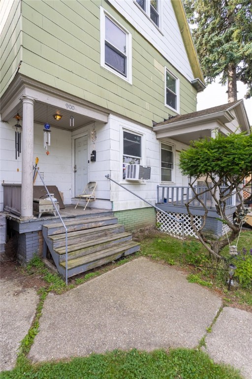 900-902 S Plymouth Ave, Rochester, NY 14608 - rear view of house featuring covered porch and cooling unit