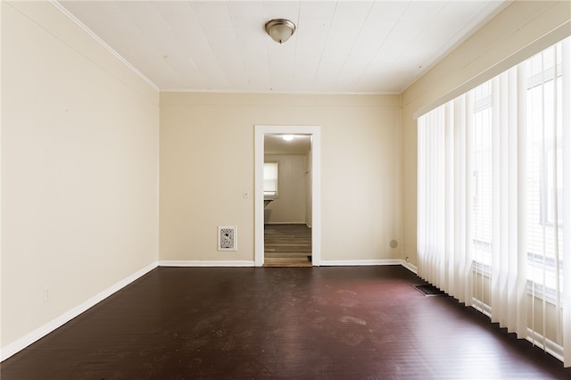 900-902 S Plymouth Ave, Rochester, NY 14608 - empty room with plenty of natural light, dark wood-type flooring, and ornamental molding