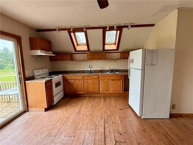 1796 Gladstone Hollow Rd, Andes, NY 13731 - kitchen featuring white appliances, under cabinet range hood, a skylight, brown cabinetry, and light wood finished floors