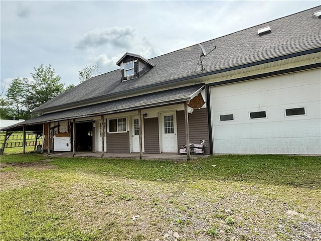 1796 Gladstone Hollow Rd, Andes, NY 13731 - back of property featuring a shingled roof, a yard, a porch, and a garage