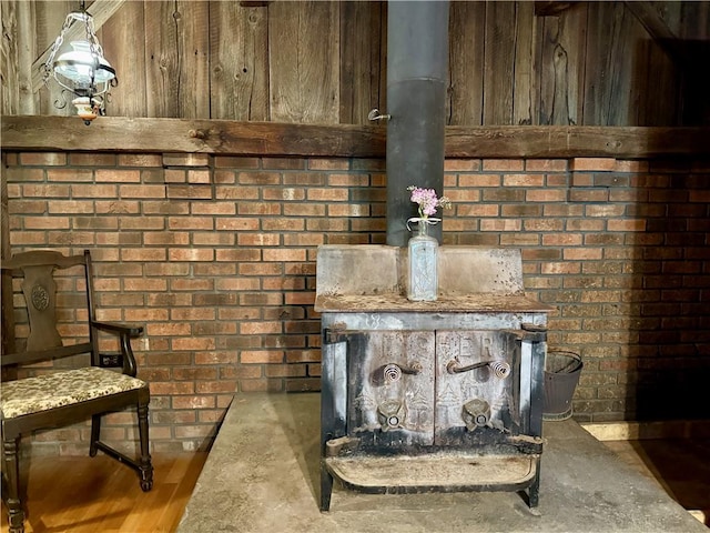 1796 Gladstone Hollow Rd, Andes, NY 13731 - detailed view of brick wall, concrete flooring, and a wood stove