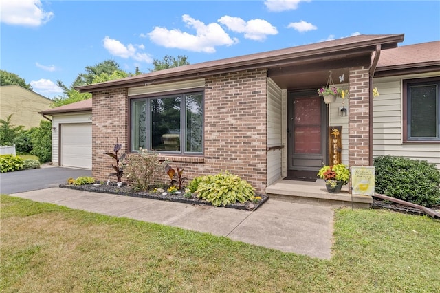 158 Round Pond Ln, Greece, NY 14626 - view of front of home featuring an attached garage, brick siding, and a front lawn