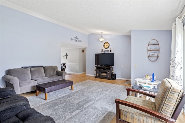 158 Round Pond Ln, Greece, NY 14626 - living room featuring light wood finished floors and a textured ceiling