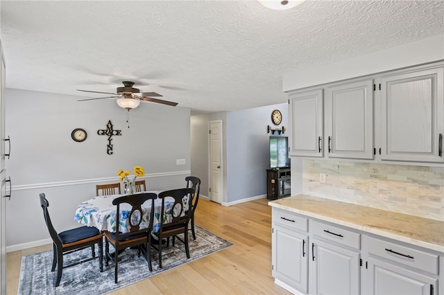 158 Round Pond Ln, Greece, NY 14626 - dining area featuring a ceiling fan, light wood-style flooring, and a textured ceiling