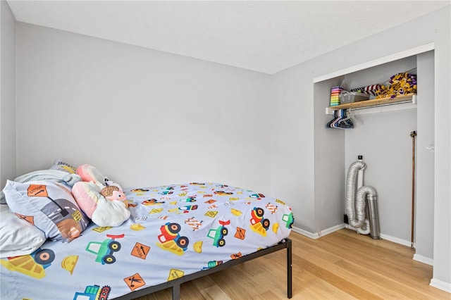 158 Round Pond Ln, Greece, NY 14626 - bedroom with light wood-style flooring and a closet