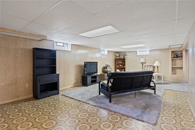 158 Round Pond Ln, Greece, NY 14626 - living room featuring wooden walls and a paneled ceiling