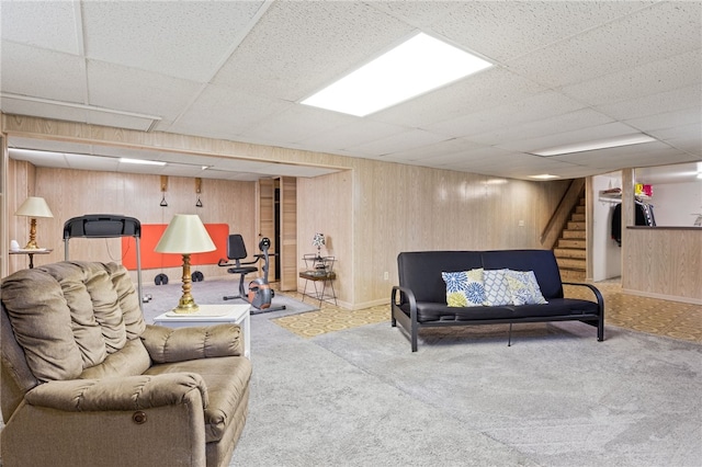 158 Round Pond Ln, Greece, NY 14626 - carpeted living area with a paneled ceiling, wood walls, and stairway