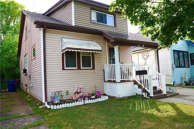 104 Argus St, Buffalo, NY 14207 - view of front of home featuring a front yard, roof with shingles, and cooling unit