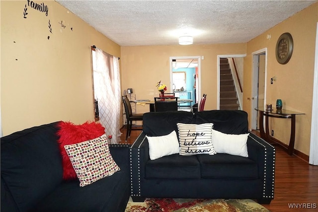104 Argus St, Buffalo, NY 14207 - living area featuring stairs, wood finished floors, and a textured ceiling