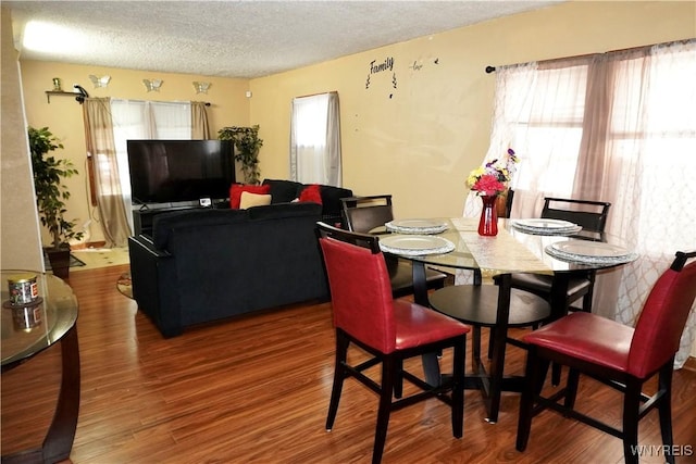 104 Argus St, Buffalo, NY 14207 - dining area with a textured ceiling and wood finished floors