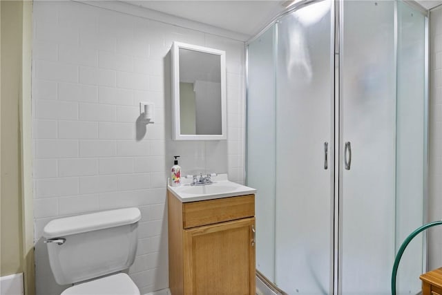 120 Furlong Rd, Brighton, NY 14623 - bathroom with a shower with shower door, vanity, and tile walls