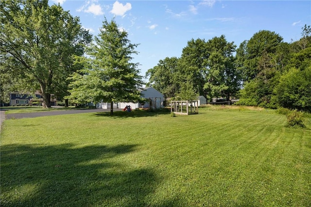 120 Furlong Rd, Brighton, NY 14623 - view of grassy yard with an outbuilding