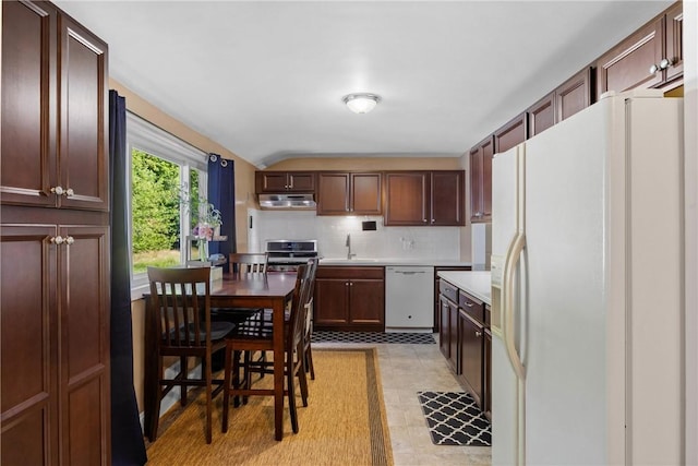 120 Furlong Rd, Brighton, NY 14623 - kitchen featuring white appliances, under cabinet range hood, backsplash, light countertops, and vaulted ceiling