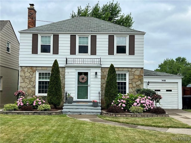 858 Starin Ave, Tonawanda, NY 14223 - colonial inspired home featuring stone siding, a front lawn, an attached garage, and concrete driveway