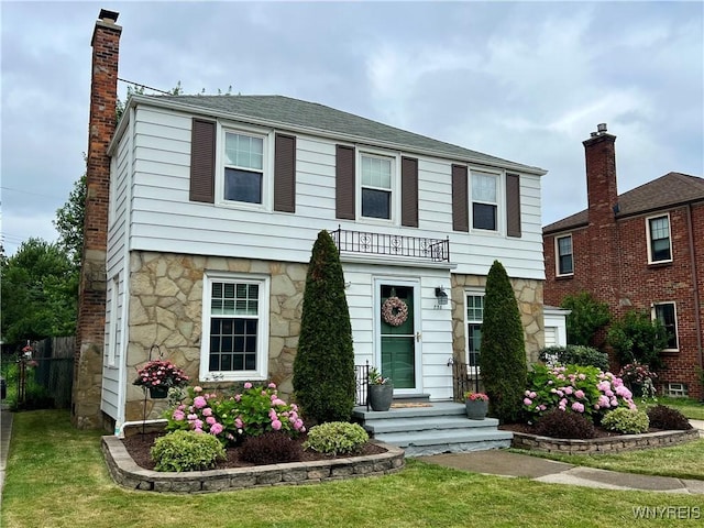 858 Starin Ave, Tonawanda, NY 14223 - view of front facade with stone siding and a chimney