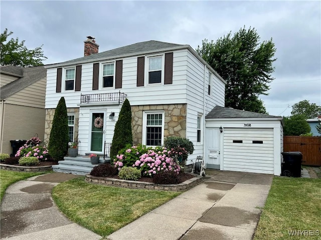 858 Starin Ave, Tonawanda, NY 14223 - view of front of home with a garage, driveway, a chimney, and stone siding