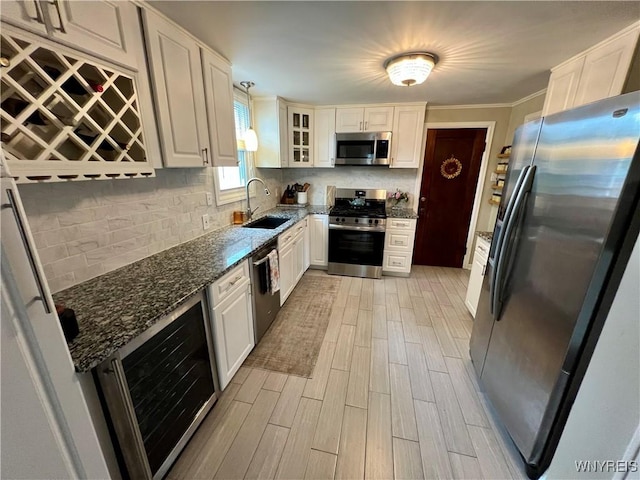 858 Starin Ave, Tonawanda, NY 14223 - kitchen with stainless steel appliances, wine cooler, dark stone countertops, tasteful backsplash, and light wood finished floors