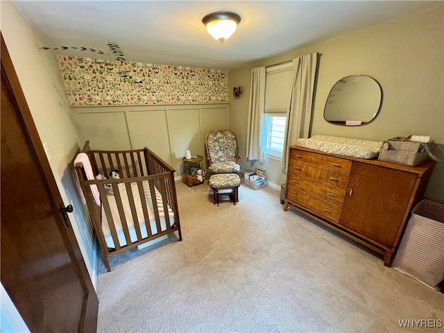 858 Starin Ave, Tonawanda, NY 14223 - bedroom with light colored carpet, wallpapered walls, a wainscoted wall, and a decorative wall