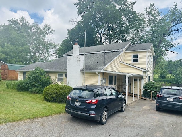 159 County Road 26, Afton, NY 13813 - view of front of home featuring a chimney, a front yard, driveway, and roof with shingles