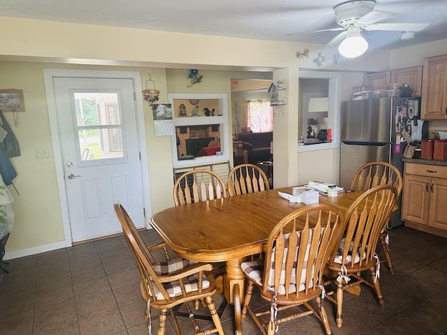 159 County Road 26, Afton, NY 13813 - dining area with dark tile patterned floors, healthy amount of natural light, and ceiling fan