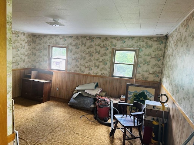 159 County Road 26, Afton, NY 13813 - living area with a wainscoted wall, wallpapered walls, wood walls, and a desk