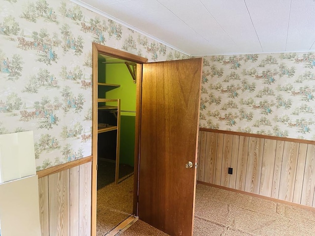 159 County Road 26, Afton, NY 13813 - empty room featuring wallpapered walls, crown molding, and wooden walls