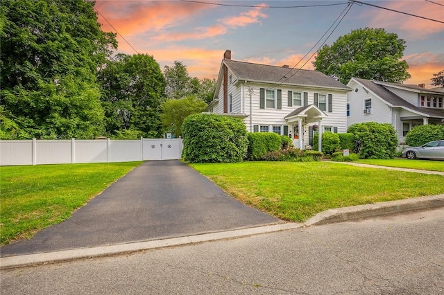 917 W Gray St, Elmira, NY 14905 - colonial-style house featuring a chimney and a gate