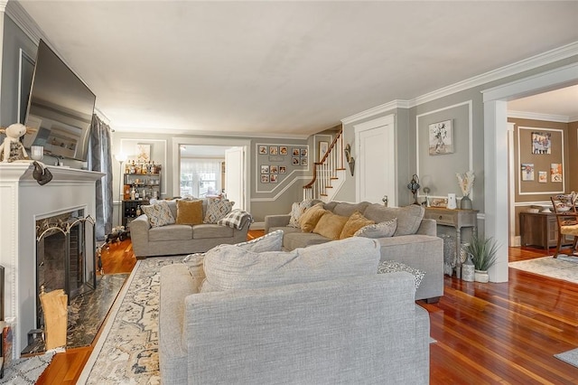 917 W Gray St, Elmira, NY 14905 - living area featuring stairs, wood finished floors, a premium fireplace, and crown molding