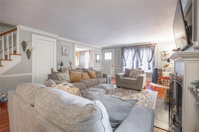 917 W Gray St, Elmira, NY 14905 - living room with wood finished floors, stairway, and ornamental molding