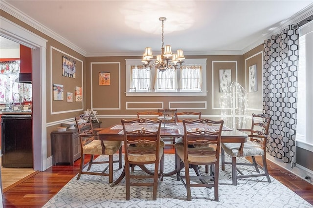 917 W Gray St, Elmira, NY 14905 - dining area with wood finished floors, a chandelier, and ornamental molding