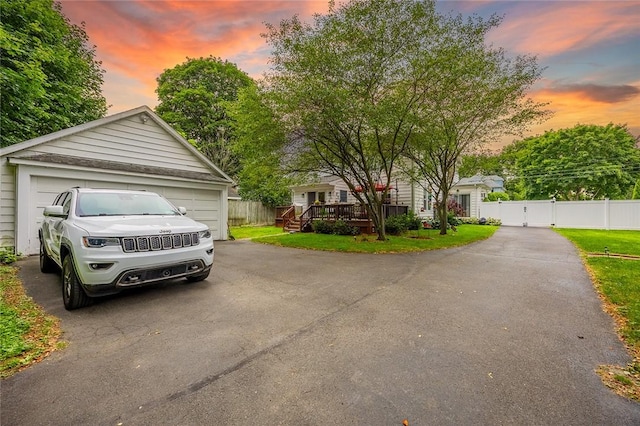 917 W Gray St, Elmira, NY 14905 - view of front facade featuring a garage, a deck, and an outbuilding