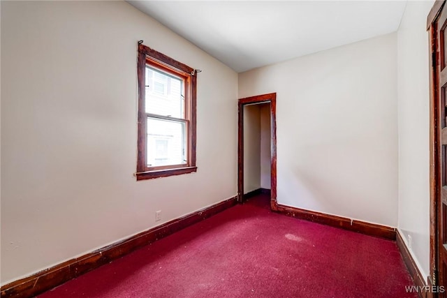 75 Schutrum St, Buffalo, NY 14212 - empty room featuring dark colored carpet and baseboards