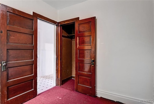 75 Schutrum St, Buffalo, NY 14212 - unfurnished bedroom with dark colored carpet and baseboards