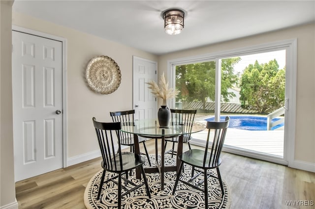 101 Kurtz Ave, Lancaster, NY 14086 - dining area with light wood-style flooring and baseboards