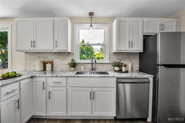 101 Kurtz Ave, Lancaster, NY 14086 - kitchen featuring stainless steel appliances, decorative backsplash, white cabinets, and light stone counters