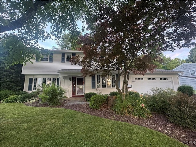 124 N Way, Camillus, NY 13031 - view of front of property with a front lawn and a garage