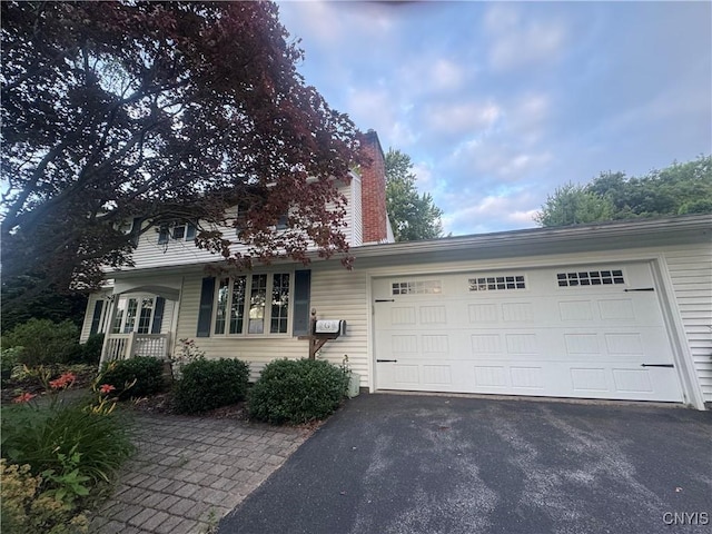 124 N Way, Camillus, NY 13031 - view of front of home with asphalt driveway and an attached garage