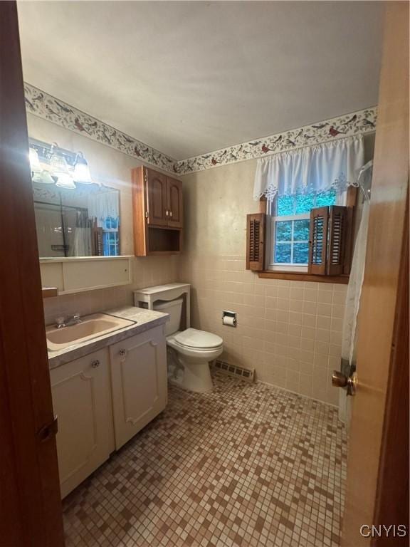 124 N Way, Camillus, NY 13031 - bathroom featuring vanity, tile patterned flooring, and tile walls
