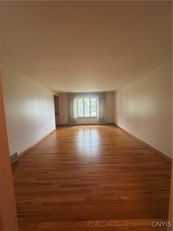 124 N Way, Camillus, NY 13031 - spare room featuring wood finished floors and baseboards