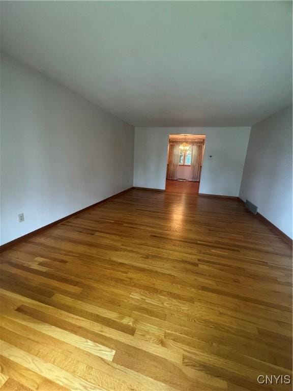 124 N Way, Camillus, NY 13031 - spare room featuring wood finished floors and baseboards