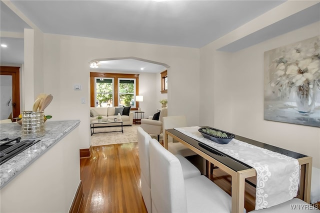 111 Montrose Ave, Buffalo, NY 14214 - dining room featuring hardwood / wood-style floors, arched walkways, and recessed lighting