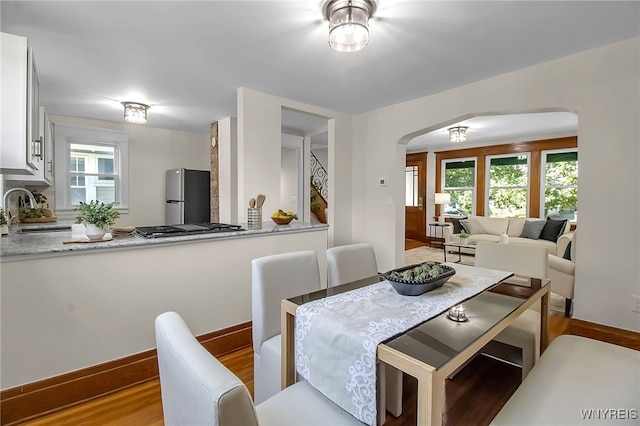 111 Montrose Ave, Buffalo, NY 14214 - dining area with arched walkways and wood finished floors