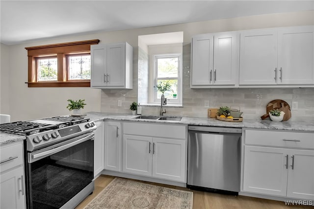 111 Montrose Ave, Buffalo, NY 14214 - kitchen featuring appliances with stainless steel finishes, healthy amount of natural light, and tasteful backsplash