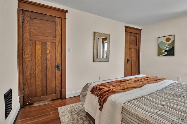111 Montrose Ave, Buffalo, NY 14214 - bedroom featuring baseboards and dark wood-style flooring