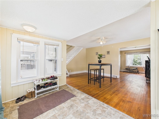 125 Phyllis Ave, Buffalo, NY 14215 - entryway featuring stairway, ceiling fan, and a textured ceiling