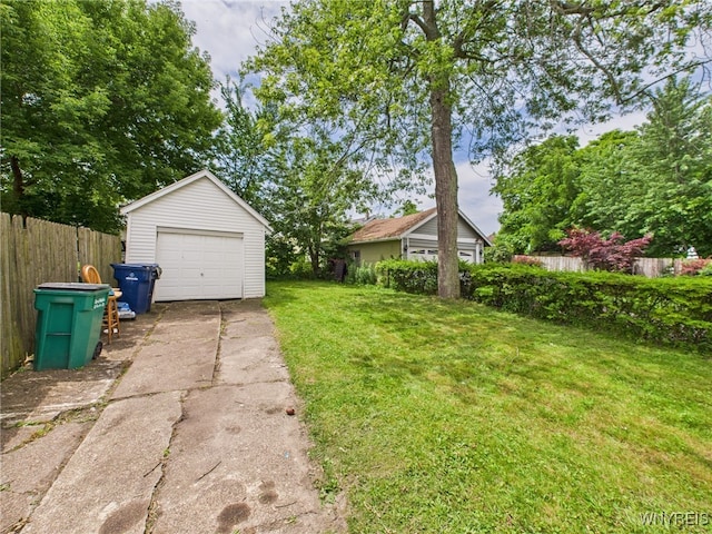 125 Phyllis Ave, Buffalo, NY 14215 - view of yard featuring concrete driveway, an outdoor structure, and a garage