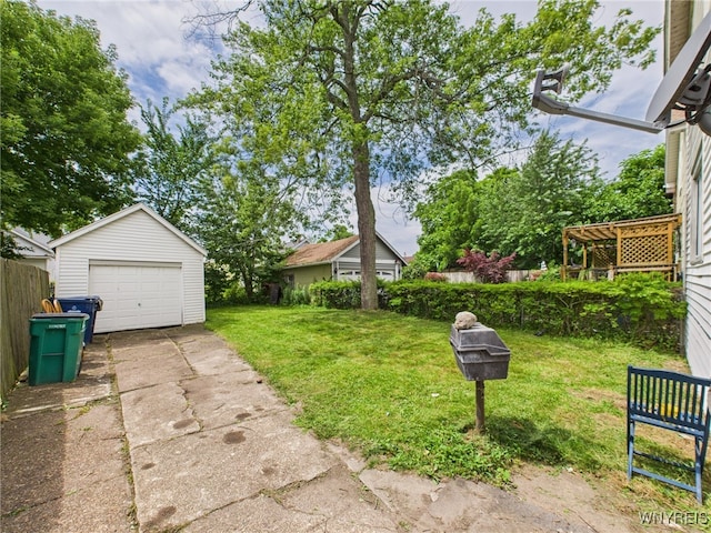 125 Phyllis Ave, Buffalo, NY 14215 - view of yard featuring driveway, an outdoor structure, and a detached garage