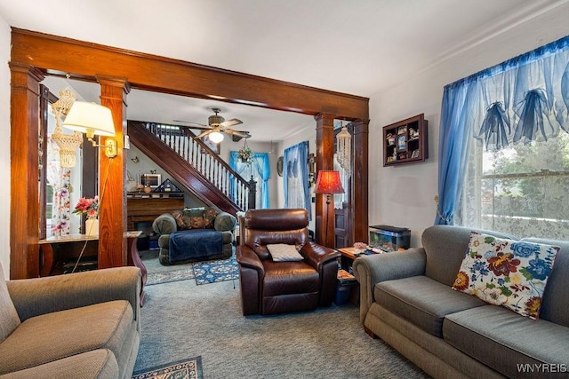 19 Reed St, Lockport City, NY 14094 - living area with carpet flooring, stairway, a ceiling fan, and ornate columns