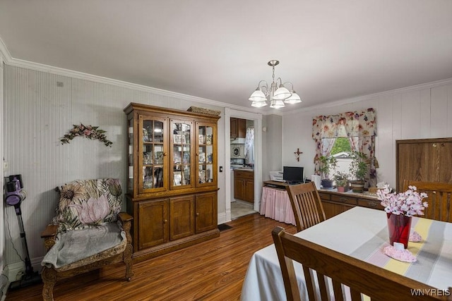 19 Reed St, Lockport City, NY 14094 - dining space featuring crown molding, a chandelier, and dark wood-type flooring